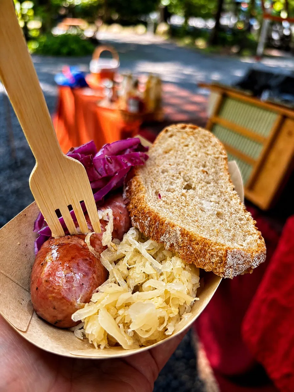 Bratwurst bowl with rye bread outdoors